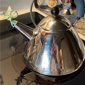 Alessi Silver Whistling Tea Kettle with Green Handle Accent